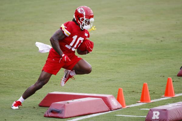 FILE - Kansas City Chiefs rookie running back Isiah Pacheco goes through a running drill during a morning workout at the team's NFL football training camp facility in St. Joseph, Mo., Sunday, July 24, 2022. Edwards-Helaire and Isiah Pacheco were drafted on opposite ends of the spectrum, one a first-round pick with high expectations and the other seventh-round selection chosen almost as an afterthought. Yet a third of the way through training camp, the two are in a heated race to be the starting running back of the Kansas City Chief. (AP Photo/Colin E. Braley, File)