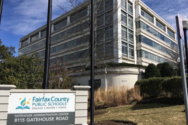 FILE - Fairfax County Public Schools is shown on March 4, 2019, in Merrifield, Va. Allegations that a northern Virginia seventh-grader was repeatedly raped and sexually assaulted at her school more than a decade ago were totally fabricated, lawyers for the school system contend in a court filing seeking the dismissal of a lawsuit she filed. The onetime student, who is now 24, stands by her claims. (AP Photo/Matthew Barakat, File)