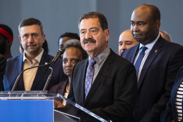 FILE - Flanked by other elected officials and representatives from the Democratic National Committee, U.S. Rep. Jesus "Chuy" Garcia speaks during a news conference on the Near West Side to advocate for the DNC to choose Chicago for its 2024 convention, July 26, 2022. Days after he easily won reelection to Congress, Garcia announced on Thursday, Nov. 10, that he will join an already crowded field of candidates hoping to unseat Chicago Mayor Lori Lightfoot as she runs for a second term. (Ashlee Rezin/Chicago Sun-Times via AP, File)