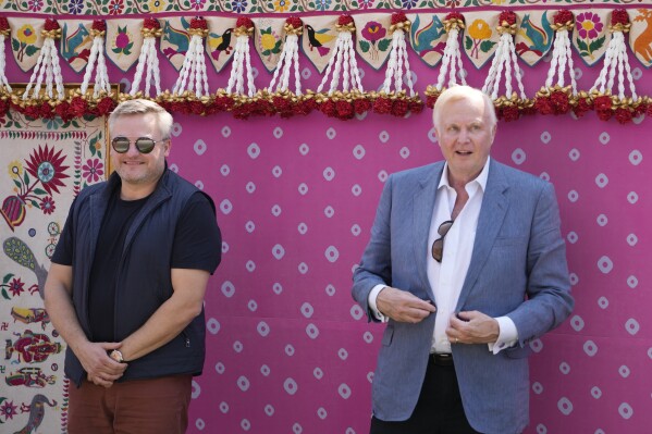 Murray Auchincloss, left, CEO of BP and Bob Dudley, former CEO of BP, pose for a photograph as they arrive to attend a pre-wedding bash of billionaire industrialist Mukesh Ambani's son Anant Ambani, in Jamnagar, India, Friday, March 1, 2024. (AP Photo/Ajit Solanki)