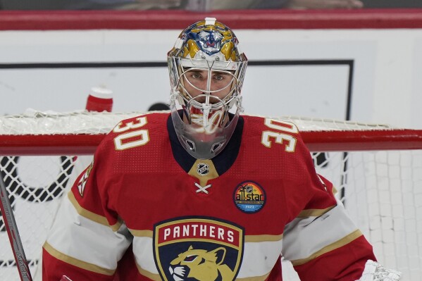 FILE - Florida Panthers goaltender Spencer Knight guards the goal during the second period of an NHL hockey game against the Dallas Stars, Thursday, Nov. 17, 2022, in Sunrise, Fla. Knight has been on the ice this week at a development camp with the Panthers. It's the first time he’s been around the team since entering the NHL/NHLPA player assistance program in February. (AP Photo/Wilfredo Lee, File)