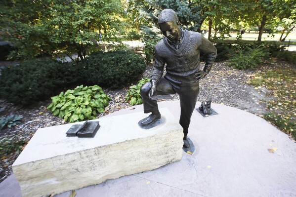 The Jack Trice statue stands on the Iowa State University campus in Ames, Iowa, in October 2023. Trice, Iowa State’s first Black athlete, carried an immense burden into his first varsity start at Minnesota in Oct. 6, 1923. He wrote in a letter the day before the game that the “honor of my race, family and self are at stake.” Trice was trampled during that game in Minneapolis, and he died two days later upon his return to Ames. He was 21. (Nirmalendu Majumdar/Ames Tribune via AP)