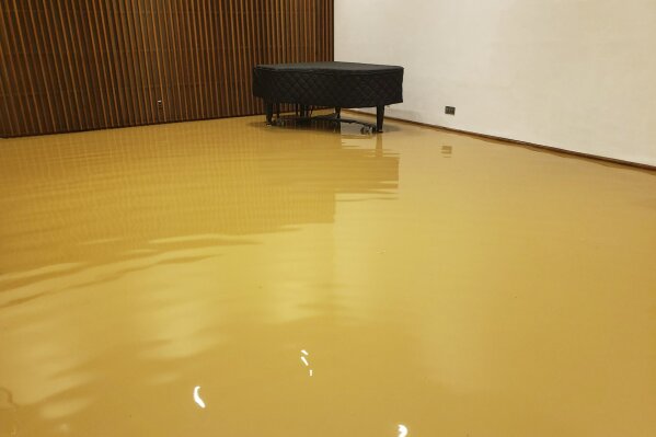This Monday, Jan. 4, 2020 photo provided by Saint Peter's Lutheran Church shows flood damage in the music room of their church in the Manhattan borough of New York after a water main break. The Lutheran church was already reeling from the COVID-19 deaths of more than 60 congregation members during the pandemic. (Saint Peter's Lutheran Church via AP)