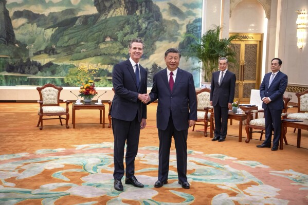 FILE - In this photo released by Office of the Governor of California, California Gov. Gavin Newsom, left, meets with Chinese President Xi Jinping at the Great Hall of the People in Beijing, on Oct. 25, 2023. Gavin Newsom's trip to China, with the stated goal of working together to fight climate change, resulted in a surprise meeting with leader Xi Jinping and was filled with warm words and friendliness not seen in years in the China- U.S. relationship. (Office of the Governor of California via AP, File)