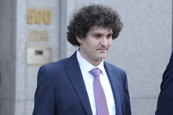 FILE - FTX founder Sam Bankman-Fried leaves Federal Court, Wednesday, July 26, 2023, in New York.  Prosecutors asked a New York judge on Friday, March 15, 2024, to sentence FTX founder Sam Bankman-Fried to between 40 and 50 years in prison for cryptocurrency crimes they described as a 
