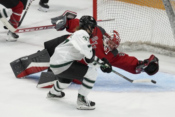 Boston's Theresa Schafzahl scores on Ottawa goalie Emerance Maschmeyer during the third period of a PWHL hockey game, Wednesday, Jan. 24, 2024 in Ottawa, Ontario. (Adrian Wyld/The Canadian Press via AP)