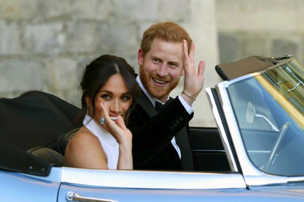 The newly married Duke and Duchess of Sussex, Meghan Markle and Prince Harry, leave Windsor Castle after their wedding in Windsor, England on May 19. (Steve Parsons/Pool via AP)