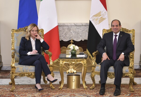 In this photo provided by Egypt's presidency media office, Egyptian President Abdel-Fattah el-Sissi, right, meets Italian Prime Minister Giorgia Meloni at the Presidential Palace in Cairo, Egypt, Sunday, March 17, 2024. (Egyptian Presidency Media Office via AP)