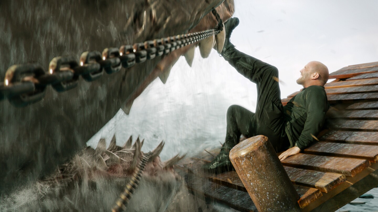 Movie Review: Spoiler alert! Jason Statham jumps even bigger sharks in 'Meg  2.' (Also, dinosaurs) | AP News