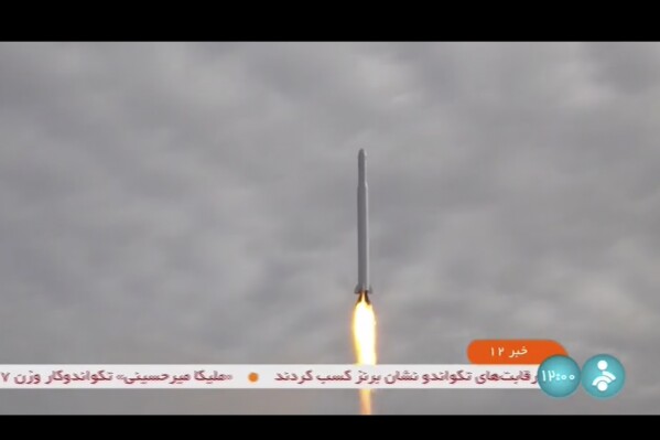 This frame grab from video aired by Iranian state television on Wednesday, Sept. 27, 2023, shows what Iran's Communication Minister Isa Zarepour said is a Noor-3 satellite being launched from an undisclosed location, in Iran. Iran claimed on Wednesday that it successfully launched an imaging satellite into space, a move that could further ratchet up tensions with Western nations that fear its space technology could be used to develop nuclear weapons. (IRIB via AP)