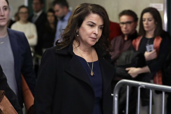 FILE - In this Jan. 23, 2020 file photo, actress Annabella Sciorra returns after a lunch break in Harvey Weinstein's rape trial in New York. More than a year after Weinstein's rape conviction, his lawyers are demanding a new trial, arguing in court papers Monday, April 5, 2021, that the landmark #MeToo prosecution that put him behind bars was buoyed by improper rulings from a judge who was "cavalier" in protecting the disgraced movie mogul's right to a fair trial. He was acquitted of first-degree rape and two counts of predatory sexual assault stemming from Sciorra’s allegations of a mid-1990s rape — testimony that his lawyers said Monday was so dated it should never have been allowed.  (AP Photo/Richard Drew, File)