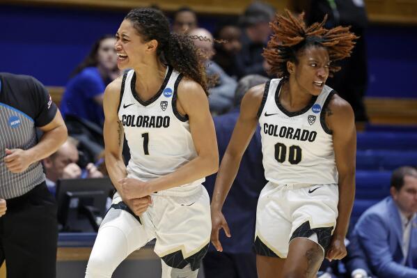 Colorado's Tayanna Jones (1) celebrates a basket with teammate Jaylyn Sherrod (00) during the first half of a first-round college basketball game against Middle Tennessee State in the NCAA Tournament, Saturday, March 18, 2023, in Durham, N.C. (AP Photo/Karl B. DeBlaker)