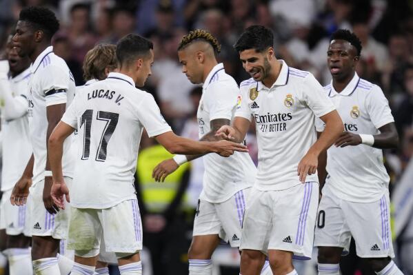 Real Madrid's Marco Asensio, second from right, celebrates scoring his side's opening goal during a Spanish La Liga soccer match between Real Madrid and Getafe at the Santiago Bernabeu stadium in Madrid, Spain, Saturday, May 13, 2023. (AP Photo/Manu Fernandez)