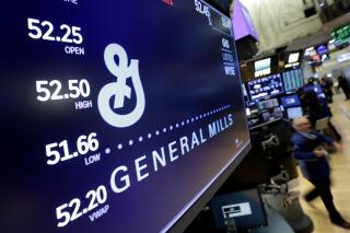 FILE - The logo for General Mills appears above a trading post on the floor of the New York Stock Exchange on Feb. 23, 2018, in New York.  General Mills is the latest big advertiser to pause its ads on Twitter as questions swirl about how the social media platform will operate under new owner Elon Musk, a spokesperson confirmed Thursday, Nov. 3, 2022. (AP Photo/Richard Drew, File)