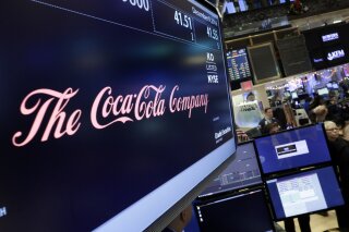 
              FILE - In this Friday, Dec. 9, 2016 file photo, the Coca-Cola logo appears above the post where it trades on the floor of the New York Stock Exchange. With obesity becoming a more pressing global problem, two January 2109 reports in science journals are calling for policies that limit industry influence and reviving debate about what role food companies should play in public health efforts. (AP Photo/Richard Drew)
            