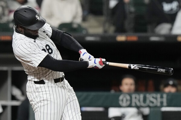 Chicago White Sox's Luis Robert Jr., hits a double against Atlanta Braves during the eighth inning of a baseball game in Chicago, Tuesday, April 2, 2024. (AP Photo/Nam Y. Huh)
