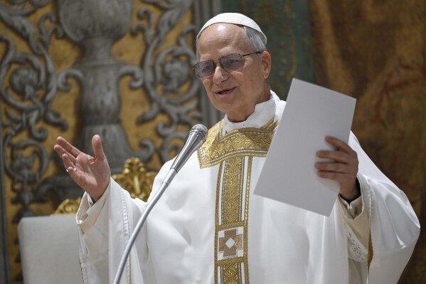 Newly elected Pope Leo XIV concelebrates Mass with the College of Cardinals inside the Sistine Chapel at the Vatican the day after his election as 267th pontiff of the Roman Catholic Church, Friday, May 9, 2025. (Vatican Media via AP)