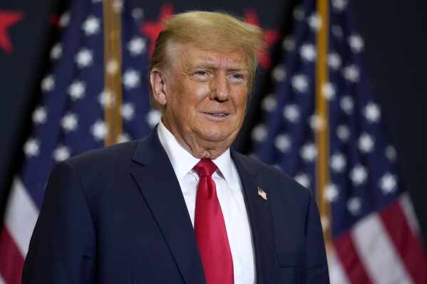 FILE - Former President Donald Trump speaks during a commit to caucus rally, Dec. 19, 2023, in Waterloo, Iowa. Police said Tuesday, Dec. 26, 2023, they are investigating incidents directed at Colorado Supreme Court justices and providing extra patrols around their homes in Denver following the court's decision to remove Trump from the state's presidential primary ballot. (AP Photo/Charlie Neibergall, File)