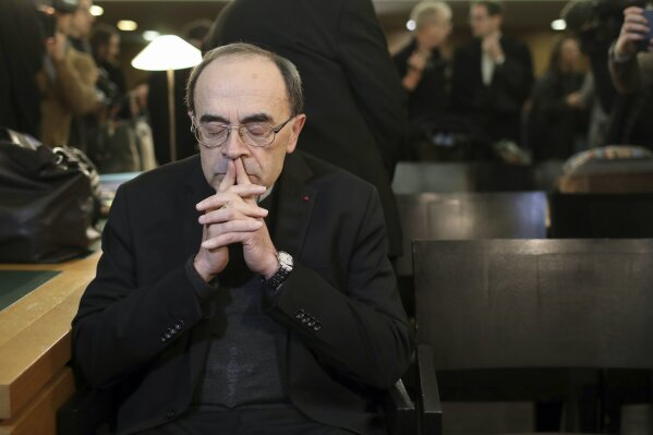 FILE - In this Jan. 7, 2019 file photo, French Cardinal Philippe Barbarin waits for the start of his trial at the Lyon courthouse, central France. France's highest court confirmed on Wednesday that the former archbishop of Lyon, Cardinal Philippe Barbarin, is not guilty of covering up the sexual crimes of a predator priest. (AP Photo/Laurent Cipriani, File)