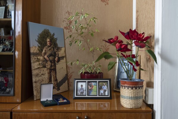 A portrait of Ukrainian soldier Serhii Hryhoriev, who died in Russian captivity, is displayed in his family's house in Pyriatyn, Ukraine, March 9, 2025. (AP Photo/Alex Babenko)