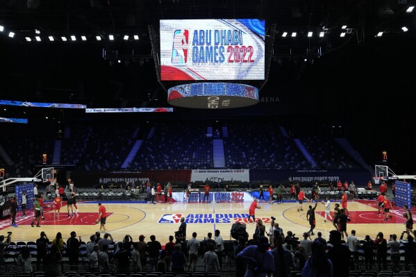 FILE - Atlanta Hawks players practice during a training session ahead of the NBA preseason basketball game against the Milwaukee Bucks in Abu Dhabi, United Arab Emirates, Tuesday, Oct. 5, 2022. There is no real basketball history in the United Arab Emirates. It has the world’s tallest building; it does not have the world’s tallest people. But in recent years, it has found ways to lure the United States – the NBA, college teams and now the national team – to bring their brands halfway across the world, with hopes of generating more interest and, of course, more money. (AP Photo/Kamran Jebreili, File)