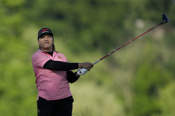 Wichanee Meechai, of Thailand, htis from the second tee during the second round of the U.S. Women's Open golf tournament at Lancaster Country Club, Friday, May 31, 2024, in Lancaster, Pa. (AP Photo/Matt Rourke)