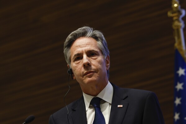U.S. Secretary of State Antony Blinken looks on during a press conference with Qatar's Prime Minister and Foreign Minister Sheikh Mohammed bin Abdulrahman Al Thani, during Blinken's week-long trip aimed at calming tensions across the Middle East, in Doha, Qatar, Sunday, Jan. 7, 2024. (Evelyn Hockstein/Pool via AP)