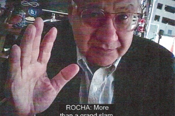 This image provided by the Justice Department and contained in the affidavit in support of a criminal complaint, shows Manuel Rocha during a meeting with a FBI undercover employee. The Justice Department says Rocha, a former American diplomat who served as U.S. ambassador to Bolivia, has been charged with serving as a covert agent for Cuba's intelligence services since at least 1981. Newly unsealed court papers allege that Manuel Rocha engaged in 