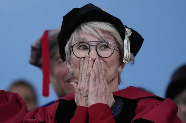 Actress and honorary degree recipient Rita Moreno reacts during her introduction during commencement ceremonies at Harvard University, Thursday, May 29, 2025, in Cambridge, Mass. (AP Photo/Charles Krupa)
