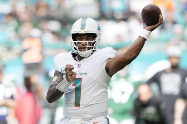 Miami Dolphins quarterback Tua Tagovailoa (1) aims a pass during the first half of an NFL football game against the New York Jets, Sunday, Dec. 17, 2023, in Miami Gardens, Fla. (AP Photo/Rebecca Blackwell)