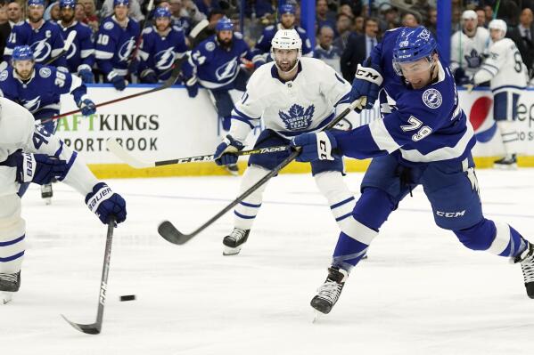 Tampa Bay Lightning center Ross Colton (79) fires the puck past Toronto Maple Leafs defenseman Ilya Lyubushkin (46) and center Colin Blackwell (11) for a goal during the second period in Game 4 of an NHL hockey first-round playoff series Sunday, May 8, 2022, in Tampa, Fla. (AP Photo/Chris O'Meara)