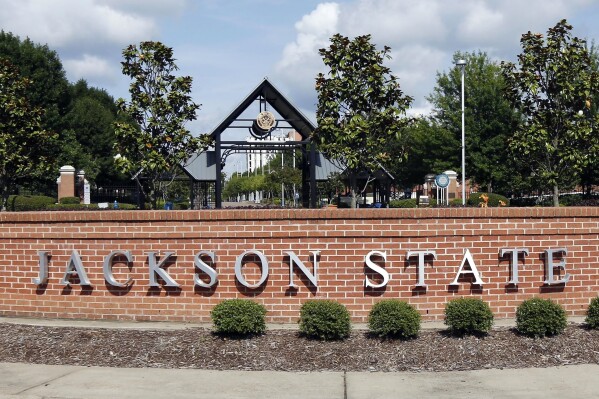 FILE - A sign marks the west entrance at Jackson State University in Jackson, Miss., May 31, 2017. Higher education officials in Mississippi voted Thursday, Nov. 16, 2023, to name Marcus L. Thompson as new president of Jackson State University, the state's largest historically Black university. (AP Photo/Rogelio V. Solis, File)