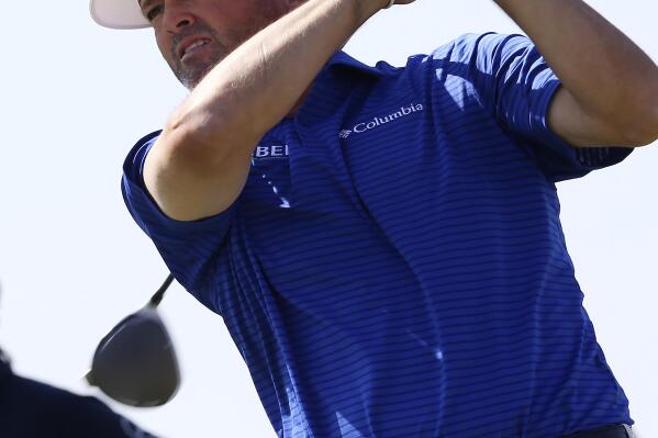 Ryan Palmer watches his shot from the 10th tee during the second day of the Valero Texas Open golf tournament at TPC San Antonio, Friday, April 1, 2022. (Jerry Lara/The San Antonio Express-News via AP)