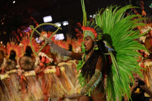 A performer from the Salgueiro samba school parades during Carnival celebrations at the Sambadrome in Rio de Janeiro, Brazil, Monday, Feb. 12, 2024. (AP Photo/Silvia Izquierdo)