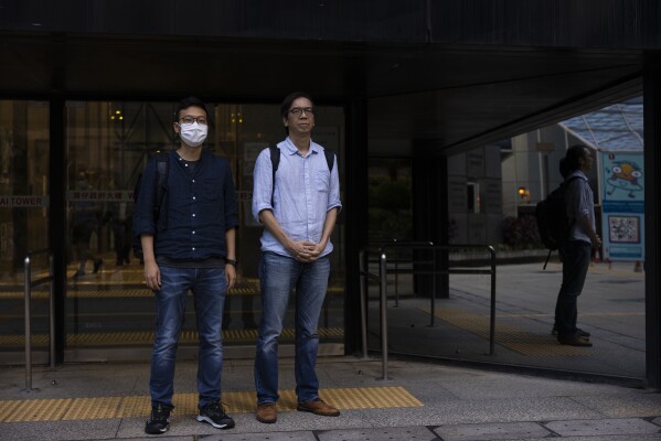 A Hong Kong courtroom convicts 2 reporters in a landmark sedition case