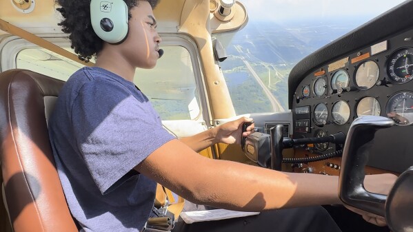 In a frame grab from video, Kyan Bovee flies over Detroit, Tuesday, Sept. 5, 2023. The Detroit teen is part of a program that teaches young people how to fly, while exposing them to careers in aviation and as pilots...areas people of color traditionally are underrepresented. (AP Photo/Carlos Osorio)