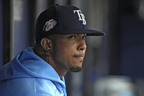 Tampa Bay Rays' Wander Franco watches from the dugout during the fifth inning of a baseball game against the Cleveland Guardians Sunday, Aug. 13, 2023, in St. Petersburg, Fla. (AP Photo/Chris O'Meara)