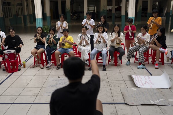 Secondary school band members rehearse for an event in Ho Chi Minh City, Vietnam, Jan. 14, 2024. (AP Photo/Jae C. Hong)