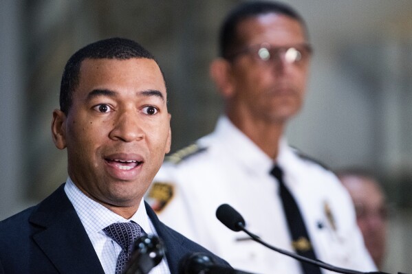 Montgomery Mayor Steven Reed speaks a news conference at City Hall in Montgomery, Ala., on Tuesday August 8, 2023, to discuss a riverfront brawl. Listening at right is Police Chief Darryl Albert. Video circulating on social media showed a large melee Saturday, Aug. 5, that appeared to begin when a crew member of a city-operated riverboat tried to get a pontoon boat moved that was blocking the riverboat from docking.(Mickey Welsh/The Montgomery Advertiser via AP)