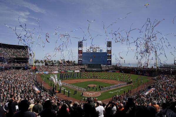 Brandon Belt captain of the ceremonial first pitch at Giants' opener