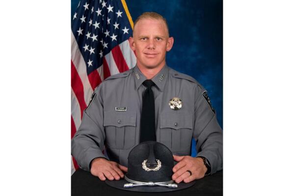 In this undated photo released by the El Paso County Sheriff's Office is Deputy Andrew Peery. Authorities say a sheriff's deputy was shot and killed Sunday, Aug. 7, 2022, while responding to a shooting in southern Colorado. Deputy Andrew Peery was a decorated member of the El Paso County Sheriff's Office SWAT team. (El Paso County Sheriff's Office via AP)