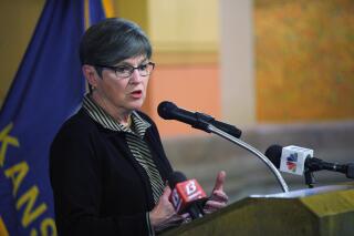 In this photo from Wednesday, April 21, 2021, Kansas Gov. Laura Kelly speaks during an event at the Statehouse in Topeka. Kan. The Democratic governor has vetoed a Republican proposal to require students to take a civics test before graduating from high school, calling it "legislative overreach." (AP Photo/John Hanna)