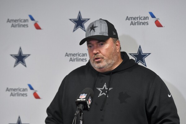 Dallas Cowboys head coach Mike McCarthy answers questions during a news conference after an NFL football game against the Buffalo Bills, Sunday, Dec. 17, 2023, in Orchard Park, N.Y. (AP Photo/Adrian Kraus)
