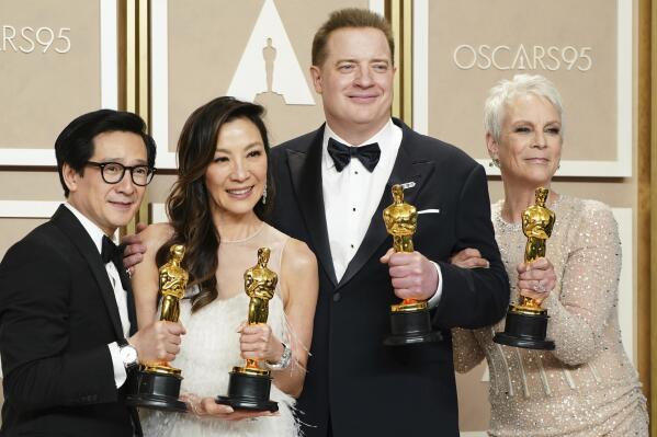 Ke Huy Quan, from left, Michelle Yeoh, Brendan Fraser and Jamie Lee Curtis pose with their awards in the press room at the Oscars on Sunday, March 12, 2023, at the Dolby Theatre in Los Angeles. Brendan Fraser, third from left, won best performance by an actor in a leading role for "The Whale." Ke Huy Quan, from left, Michelle Yeoh and Jamie Lee Curtis all won for their leading and supporting roles in "Everything Everywhere All at Once." (Photo by Jordan Strauss/Invision/AP)