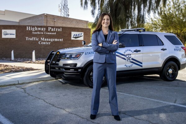 Anne Carpenter poses at the Nevada Highway Patrol Southern Command Traffic Management Center, Thursday, Nov. 19, 2020, in Las Vegas. After climbing the ranks of the Nevada Department of Public Safety for the past 25 years, Carpenter became the first woman appointed to NHP colonel, the agency's highest rank. (L.E. Baskow/Las Vegas Review-Journal via AP)