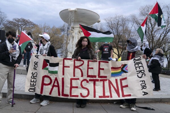 Protesters demonstrate in support of Palestinians at Dupont Circle in Washington, Saturday, March 30, 2024. (AP Photo/Jose Luis Magana)