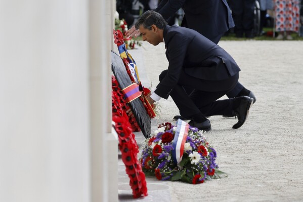Britain's Prime Minister Rishi Sunak lays a wreath during a commemorative ceremony marking the 80th anniversary of the World War II D-Day" Allied landings in Normandy, at the World War II British Normandy Memorial of Ver-sur-Mer, Thursday, June 6, 2024. Normandy is hosting various events to officially commemorate the 80th anniversary of the D-Day landings that took place on June 6, 1944. (Ludovic Marin/Pool via AP)