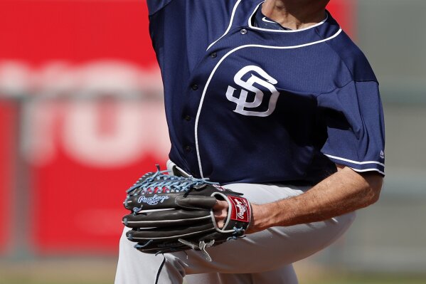 FILE - In this March 1, 2018, file photo, San Diego Padres pitcher Chris Young throws during the third inning of a spring training baseball game against the Texas Rangers in Surprise, Ariz. The Rangers hired Young as executive vice president and general manager Friday, Dec. 4, 2020, bringing the Major League Baseball executive home to work under president of baseball operations Jon Daniels, the club's GM since 2005. (AP Photo/Charlie Neibergall, File)