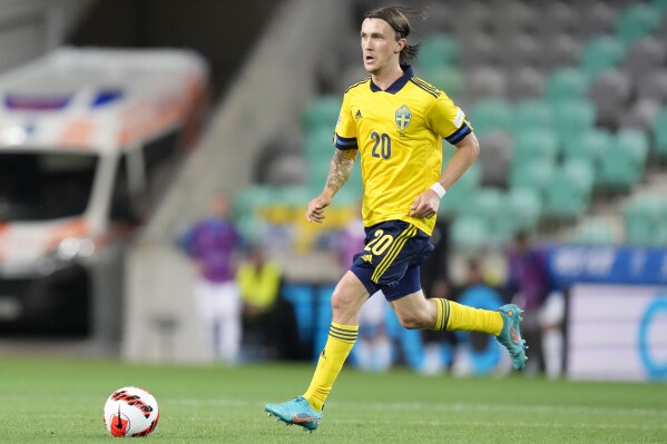 FILE - Sweden's Kristoffer Olsson is in action during the UEFA Nations League soccer match between Slovenia and Sweden at the Stozice stadium in Ljubljana, Slovenia, Thursday, June 2, 2022. Sweden midfielder Kristoffer Olsson has been hospitalized with an acute brain condition after suddenly losing consciousness at home, his Danish club FC Midtjylland said Tuesday, Feb. 27. 2024. (AP Photo/Darko Bandic, File)