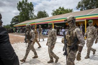 FILE - Leader of Mali's ruling junta Lt. Col. Assimi Goita, center, attends an independence day military parade in Bamako, Mali on Sept. 22, 2022. Mali's military junta leader on Friday Jan. 6, 2023 pardoned 49 soldiers from neighboring Ivory Coast who were convicted of undermining Mali's state security and conspiracy against the government. (AP Photo, File)